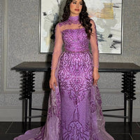 Elegant Iyza Belaar Deema long dress with high neckline, tulle fabric, and intricate embroidery, perfect for formal occasions.