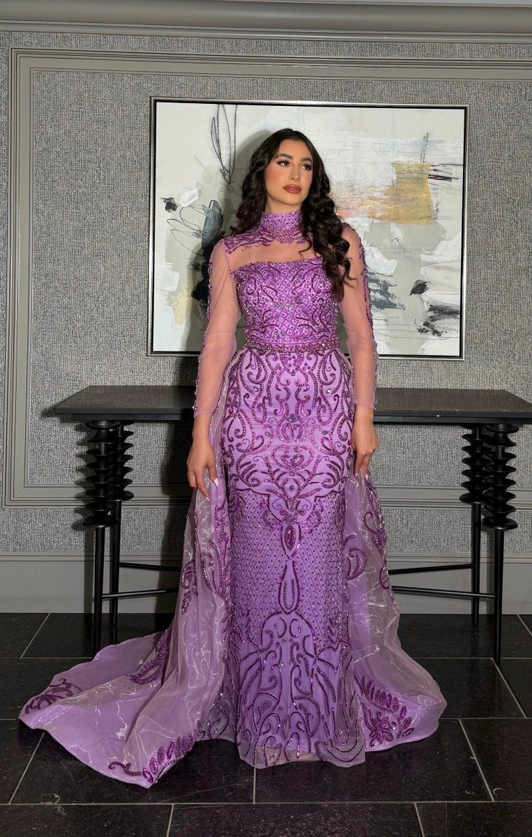 Elegant Iyza Belaar Deema long dress with high neckline, tulle fabric, and intricate embroidery, perfect for formal occasions.