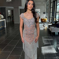 Iyza Belaar long beaded tassel dress featuring a cap sleeve design and elegant detailing, perfect for formal occasions.