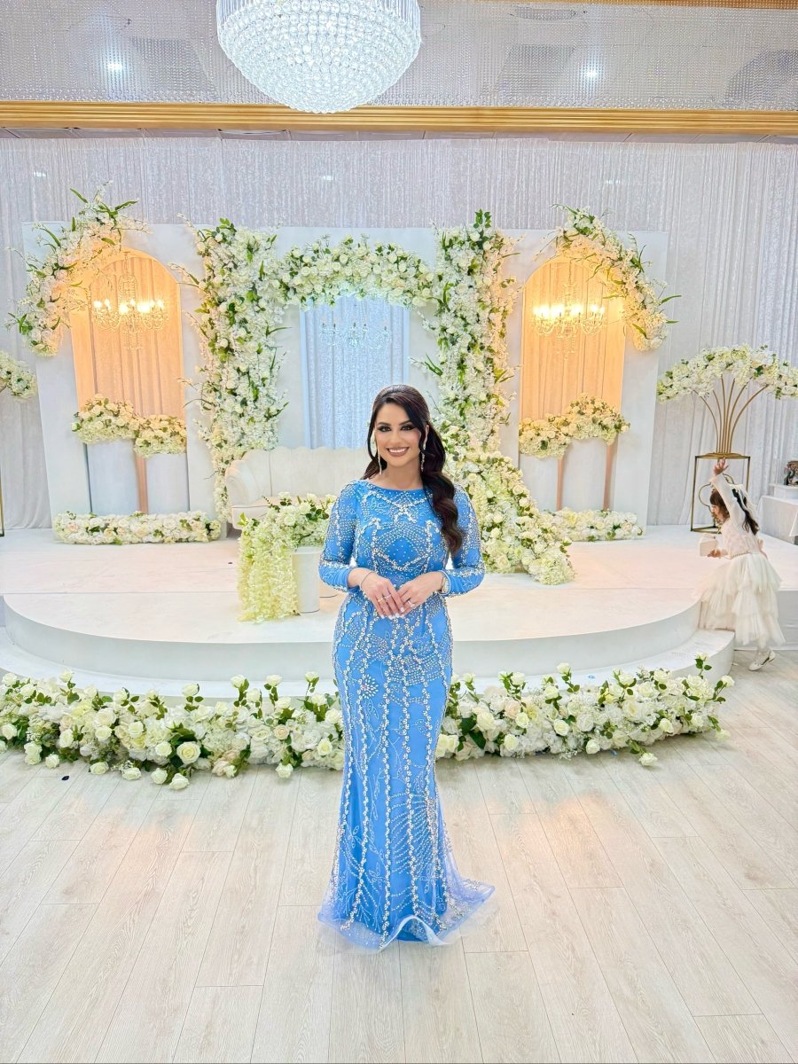 Iyza Belaar Fariza long sleeve modest evening dress with beaded embellishments, elegant and floor-length for formal occasions.