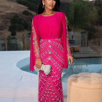 Iyza Belaar Hosai embellished long sleeve evening dress featuring dramatic design and modest style, perfect for formal occasions.