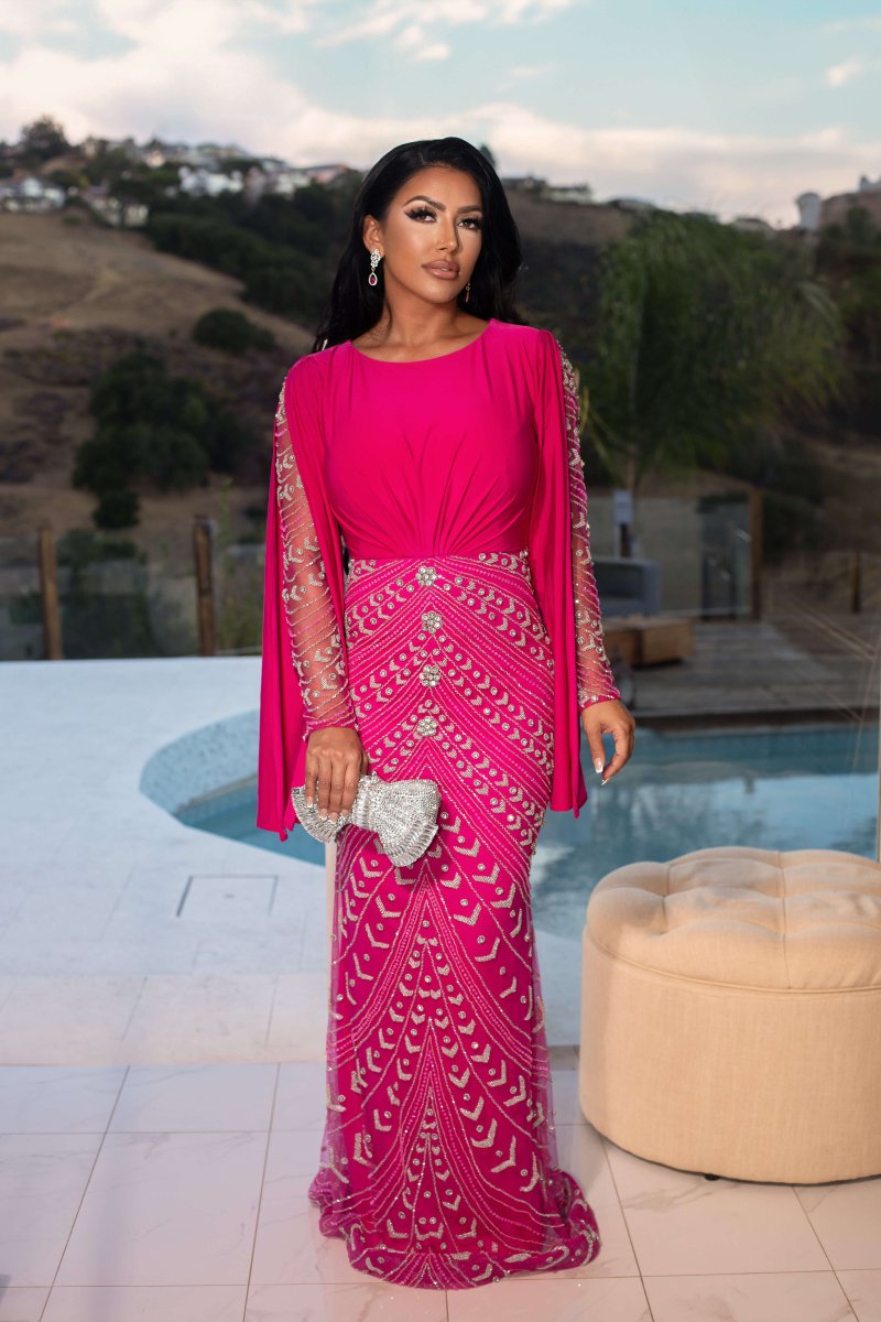 Iyza Belaar Hosai embellished long sleeve evening dress featuring dramatic design and modest style, perfect for formal occasions.