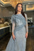 Iyza Belaar Imani long sleeve side skirt dress, a stylish long dress with elegant design and side slit detail.