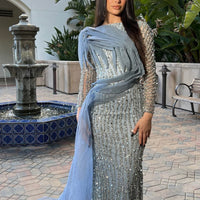 Iyza Belaar Imani long sleeve side skirt dress, elegant long dress with side slit and fitted silhouette, worn for formal occasions