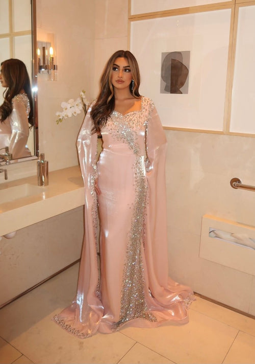 Iyza Belaar Munira long sleeve organza drape modest dress, flowing long dress with elegant sheer sleeves and a modest design.