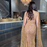 Iyza Belaar Nabilah Embellished Cape Sleeve Long Dress, elegant evening gown with intricate embellishments and cape sleeves.