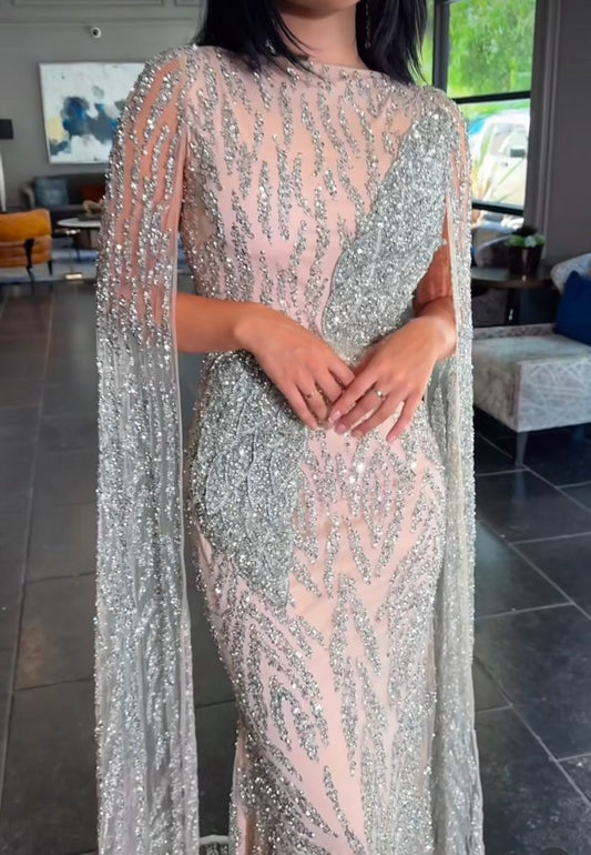 Iyza Belaar Nabilah embellished cape sleeve long dress with intricate details and elegant design, perfect for formal occasions.