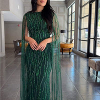 Iyza Belaar Faramah Drape Sleeves embellished fitted sequin evening dress, long modest gown with elegant design and intricate details.