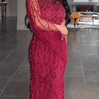 Iyza Belaar Faramah Drape Sleeves embellished fitted sequin evening dress, long modest gown with elegant design and detailed embellishments.