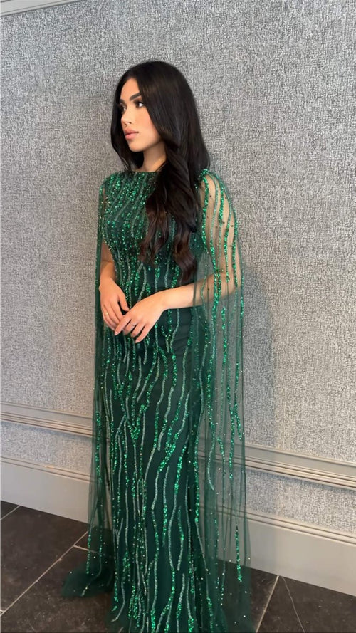 Elegant Faramah Drape Sleeves embellished fitted sequin evening dress by Iyza Belaar, featuring a modest long dress design.