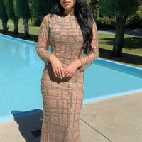 Silver beaded modest long sleeve dress by Iyza Belaar featuring Sahara embellishments and elegant design.