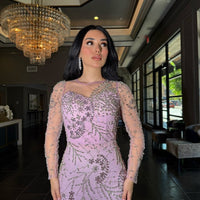 Iyza Belaar Moral Modest Long Sleeve Flower Mermaid Gown, elegant long sleeve dress with floral pattern and fitted mermaid silhouette.