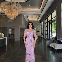 Iyza Belaar moral modest long sleeve flower mermaid gown, elegant evening dress with floral pattern and fitted silhouette.