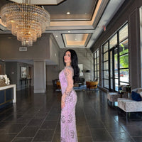Iyza Belaar moral modest long sleeve flower mermaid gown showcasing elegant floral pattern and fitted silhouette.