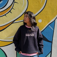 Navy sweatshirt by JZD with anti-racism message, featuring a comfortable fit and printed text on the front.