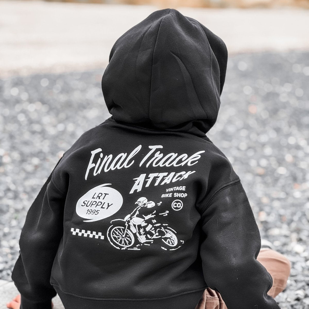Baby and toddler The Final Track Attack Hoodie by Little Rad Things in recycled black, cozy outerwear for little ones.