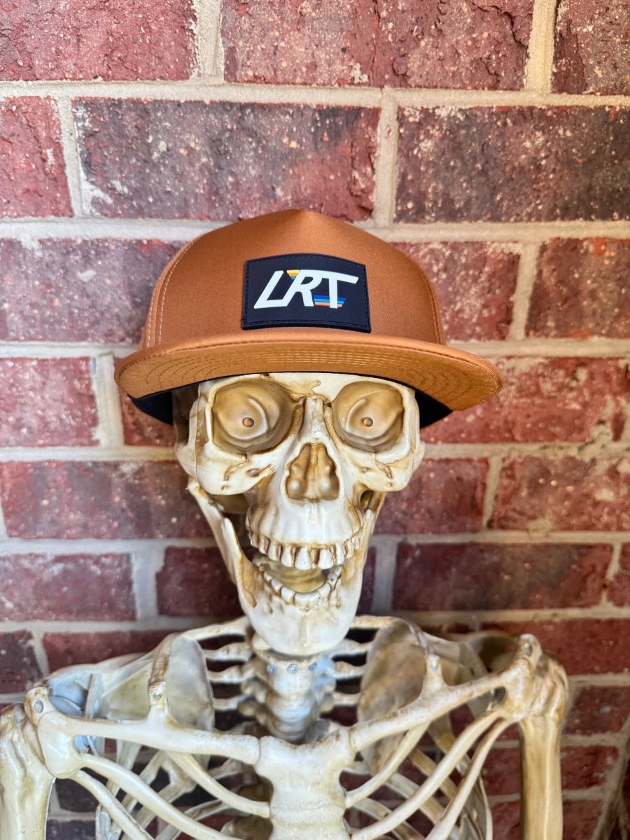 Little Rad Things waterproof age snapback hat in chestnut color, featuring adjustable strap and breathable fabric.