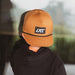 Little Rad Things waterproof age snapback hat in chestnut color with adjustable strap and breathable design.