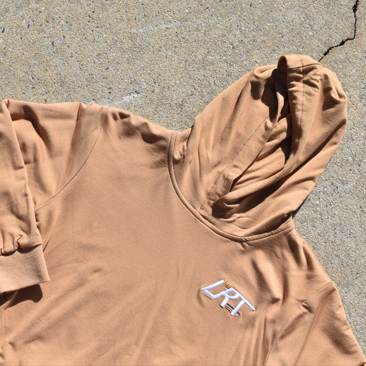 Little Rad Things LRT Bamboo Hoodie in rust color, soft bamboo fabric, shown on a model with a cozy, casual fit.