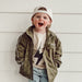 Little Rad Things Storm Rider waterproof jacket in army green, shown with front zipper and hood for outdoor protection.
