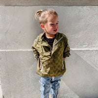 Little Rad Things Storm Rider waterproof jacket in army green, showing the durable, waterproof fabric and adjustable hood.