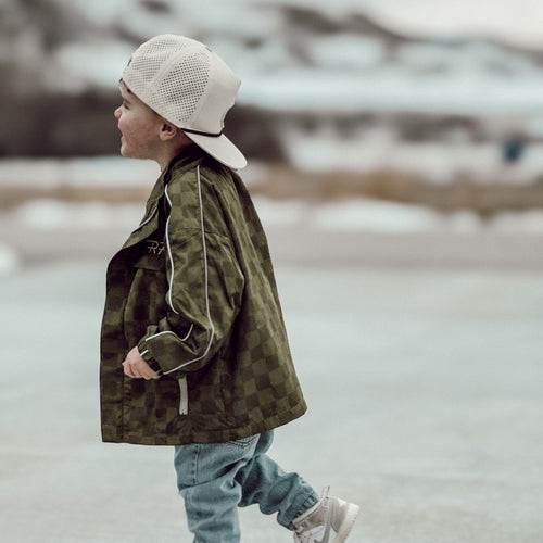 Little Rad Things Storm Rider waterproof jacket in army green, shown with weather-resistant fabric and adjustable hood.