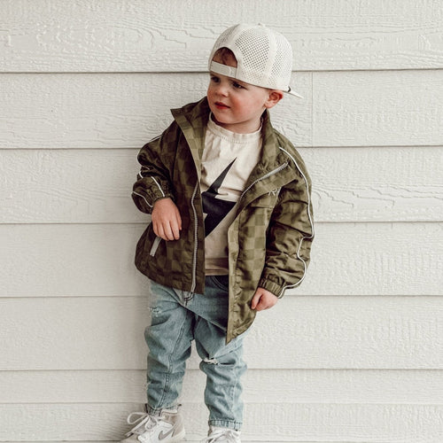 Little Rad Things Storm Rider waterproof jacket in army green, outdoor gear with a hood and adjustable cuffs.