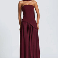 Cherry lacquer Maliyah maxi dress with chiffon skirt and matching scarf by MANDOTOS, shown on a model.