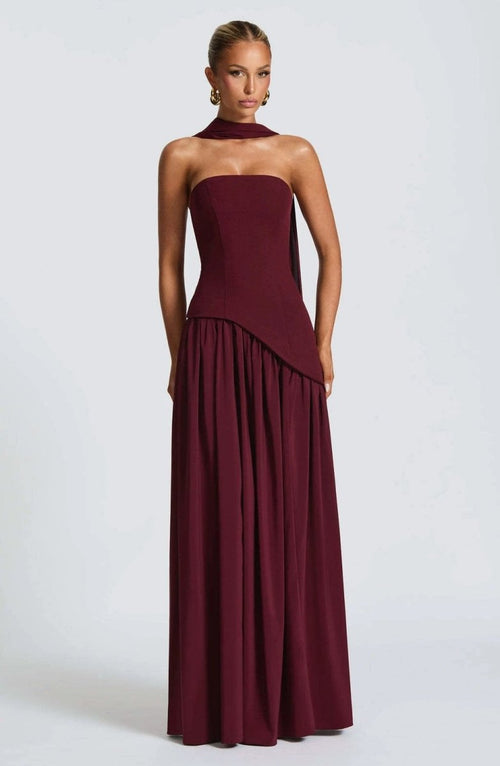 Cherry lacquer Maliyah maxi dress with chiffon skirt and matching scarf by MANDOTOS, shown on a model.