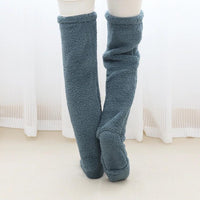 Mandotos cozy winter knee-high fuzzy socks designed for warmth and comfort during cold weather.