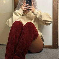 Mandotos cozy winter knee-high fuzzy socks designed for warmth and comfort during cold weather.
