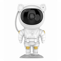 Mandotos astronaut galaxy starry sky projector nightlight illuminating a bedroom with USB-powered atmospheric lighting.