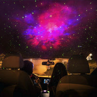 Mandotos astronaut galaxy starry sky projector nightlight illuminating a bedroom with USB-powered atmospheric lighting.