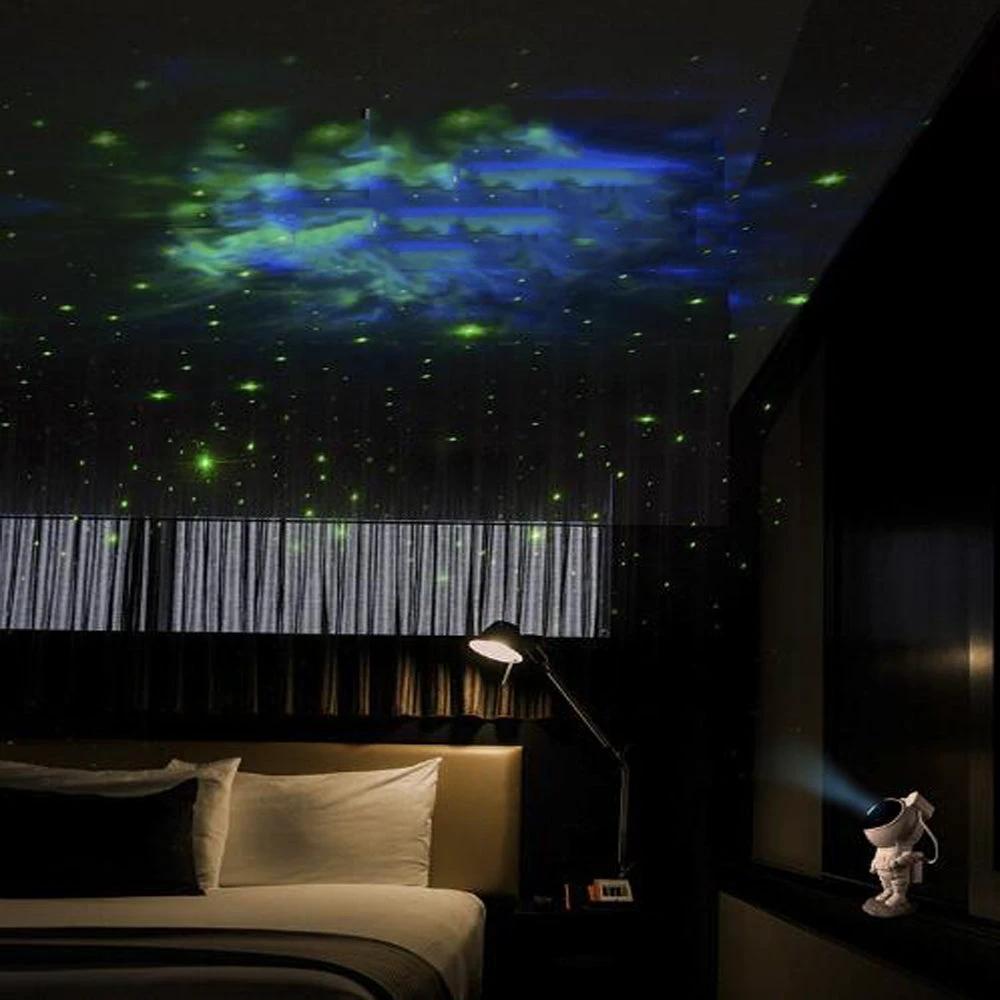 Mandotos creative astronaut galaxy starry sky projector nightlight USB bedroom table lamp displaying colorful galaxy and star patterns.