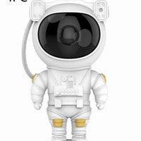 Mandotos astronaut galaxy starry sky projector nightlight displaying colorful stars and planets in a bedroom atmosphere.