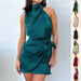 Mandotos elegant sleeveless halter neck dress with waist tie, perfect for evening parties and stylish women’s fashion.