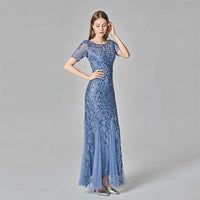 Elegant black evening dress by MANDOTOS, featuring a flowing silhouette and stylish design for formal occasions.