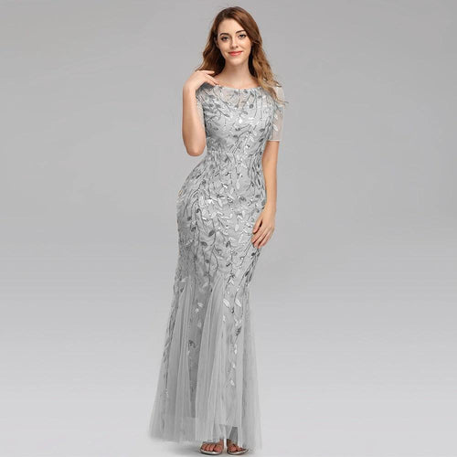 Elegant MANDOTOS evening dress with a flowing fabric and intricate design, perfect for formal occasions.