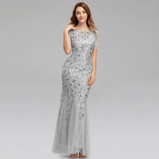 Elegant MANDOTOS evening dress with a flowing fabric and intricate design, perfect for formal occasions.