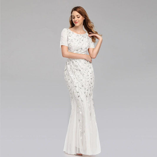 Mandotos evening dress in elegant black fabric with a flowing design, perfect for formal occasions.