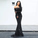 Elegant black evening dress by MANDOTOS featuring a fitted silhouette and stylish neckline, perfect for formal occasions.