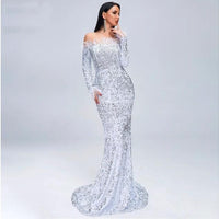 Elegant black evening dress by MANDOTOS featuring a fitted silhouette and stylish design for formal occasions.
