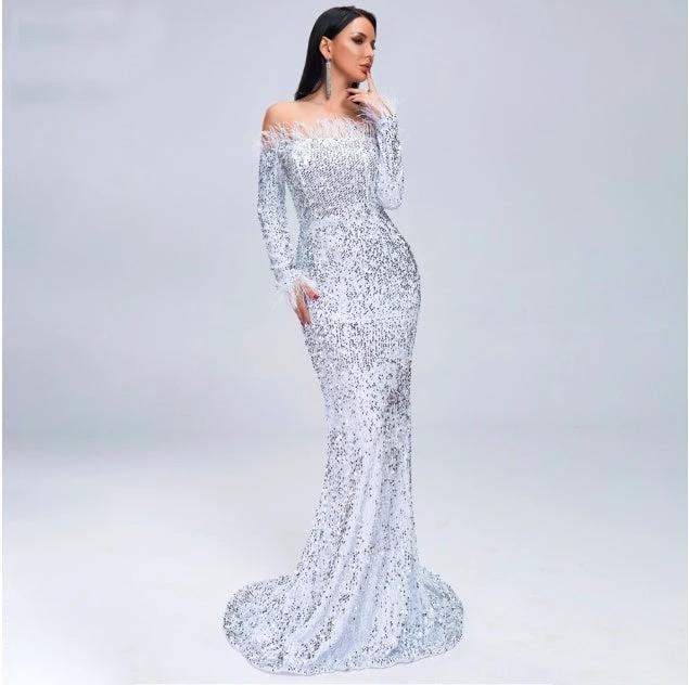 Elegant black evening dress by MANDOTOS featuring a fitted silhouette and stylish design for formal occasions.