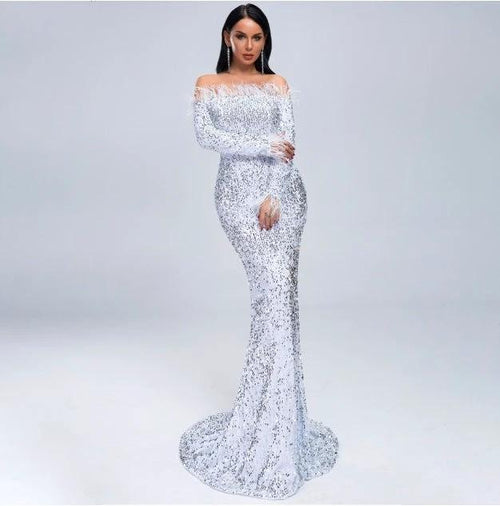 Elegant MANDOTOS evening dress featuring a flowing fabric and sophisticated design, perfect for formal occasions.