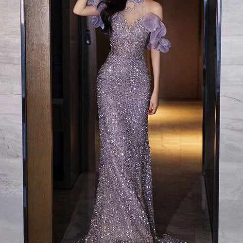 Elegant women's evening gown by MANDOTOS featuring a halter neckline and French-inspired style, displayed on a mannequin.