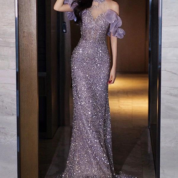 Elegant women's evening gown by MANDOTOS featuring a halter neckline and French-inspired style, displayed on a mannequin.