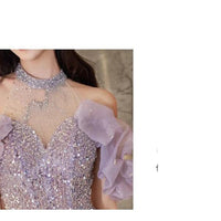 Women's halter evening gown by MANDOTOS, French style, flowing fabric, elegant design suitable for formal occasions
