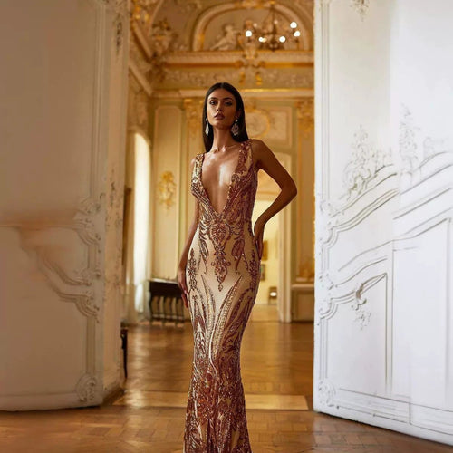 Female creative V-neck heavy industry dress by MANDOTOS, featuring a stylish design and modern silhouette.