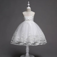 First Communion flower girl dress by Mandotos with lace trim, tulle fabric, and intricate bead embroidery.
