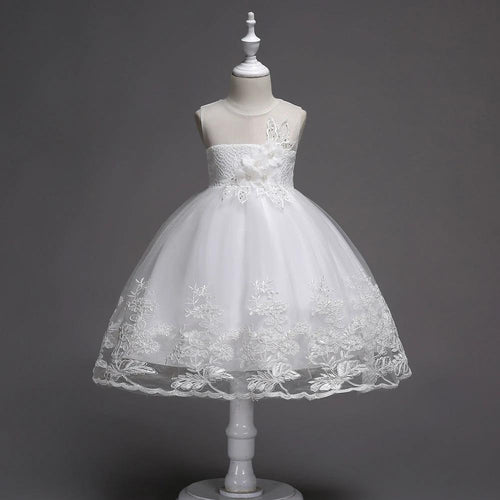 First Communion flower girl dress by Mandotos with lace trim, tulle fabric, and intricate bead embroidery.